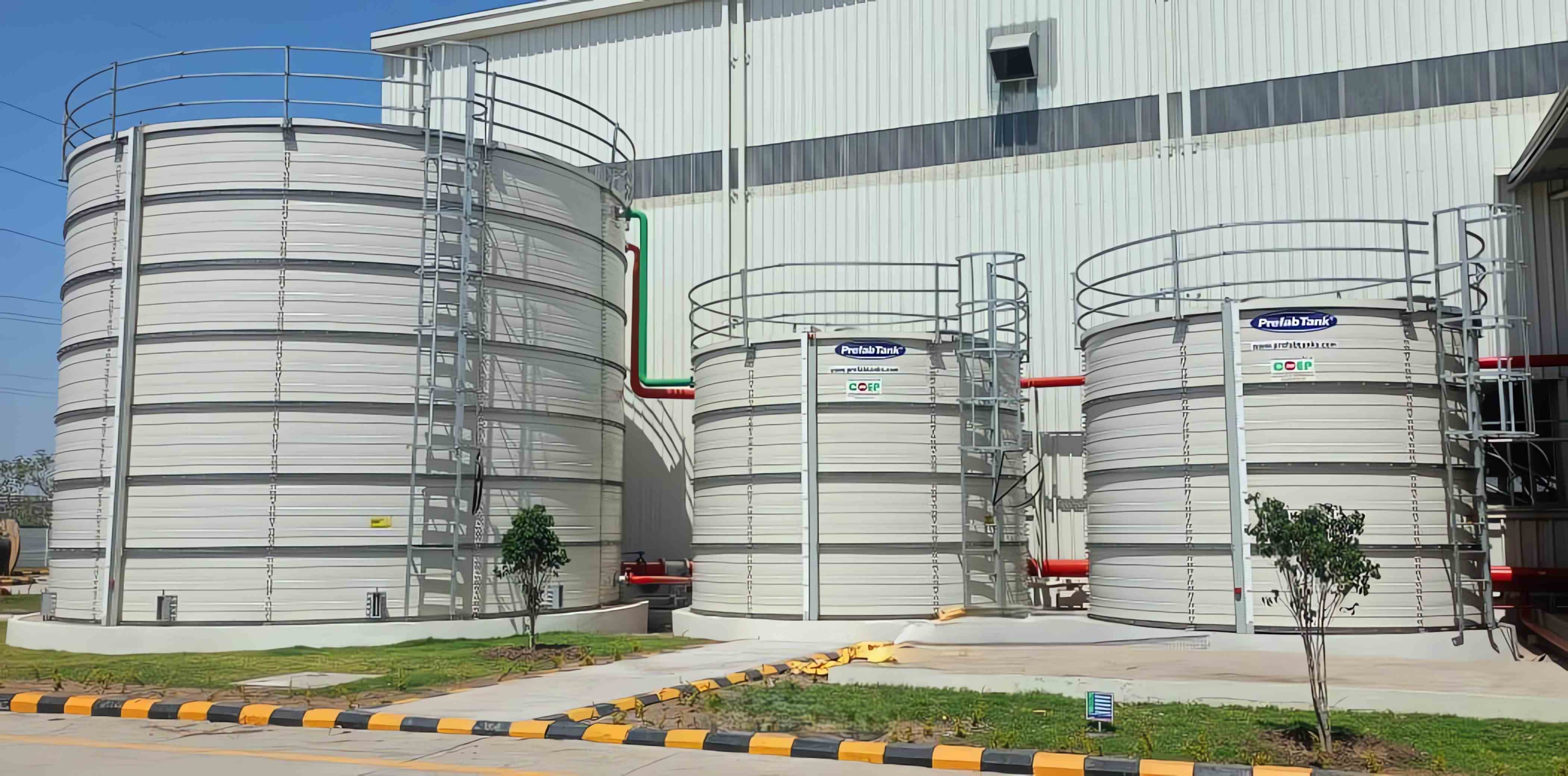 Multiple prefabricated tanks installed at an industrial facility